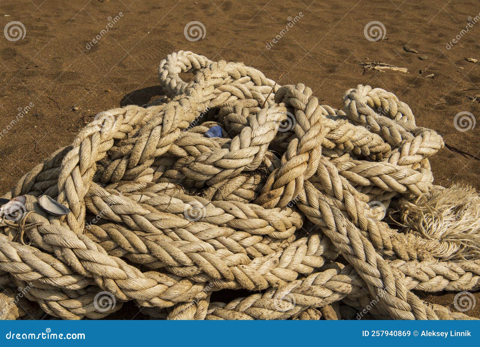 A big rope on the sand stock image. Image of object 257940869