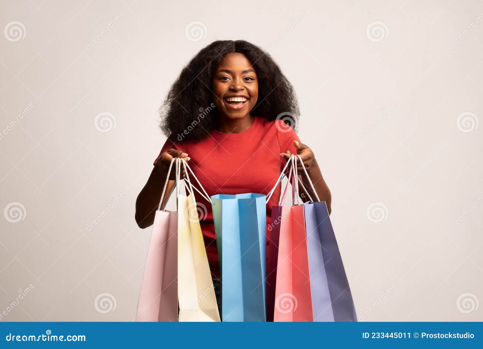 Big Sales. Happy Black Lady Holding Lots of Bright Paper Shopping Bags ...