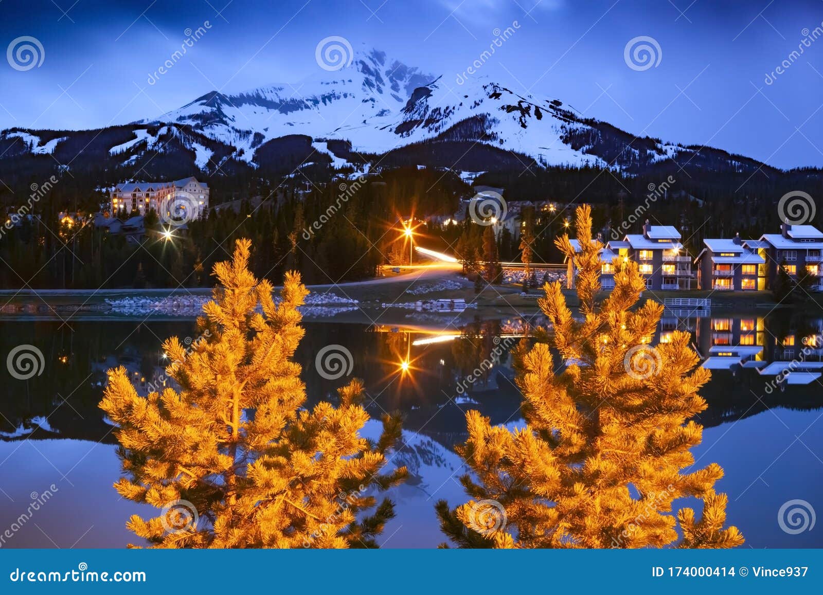 big sky mountain village on dusk, snowy lone mountain, montana usa