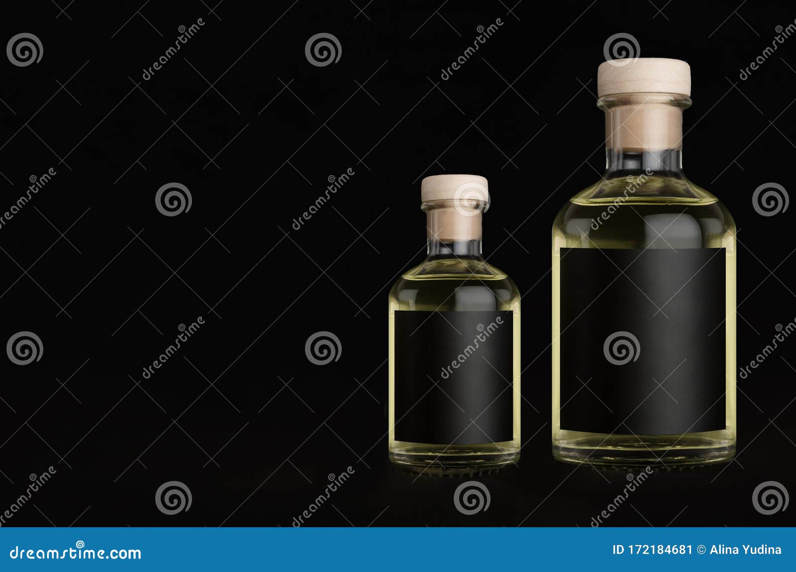 Download Big And Small Glass Bottles For Cosmetic Perfume Drink With Black Label Cork Yellow Liquid On Black Background Mock Up Stock Image Image Of Branding Design 172184681 Yellowimages Mockups