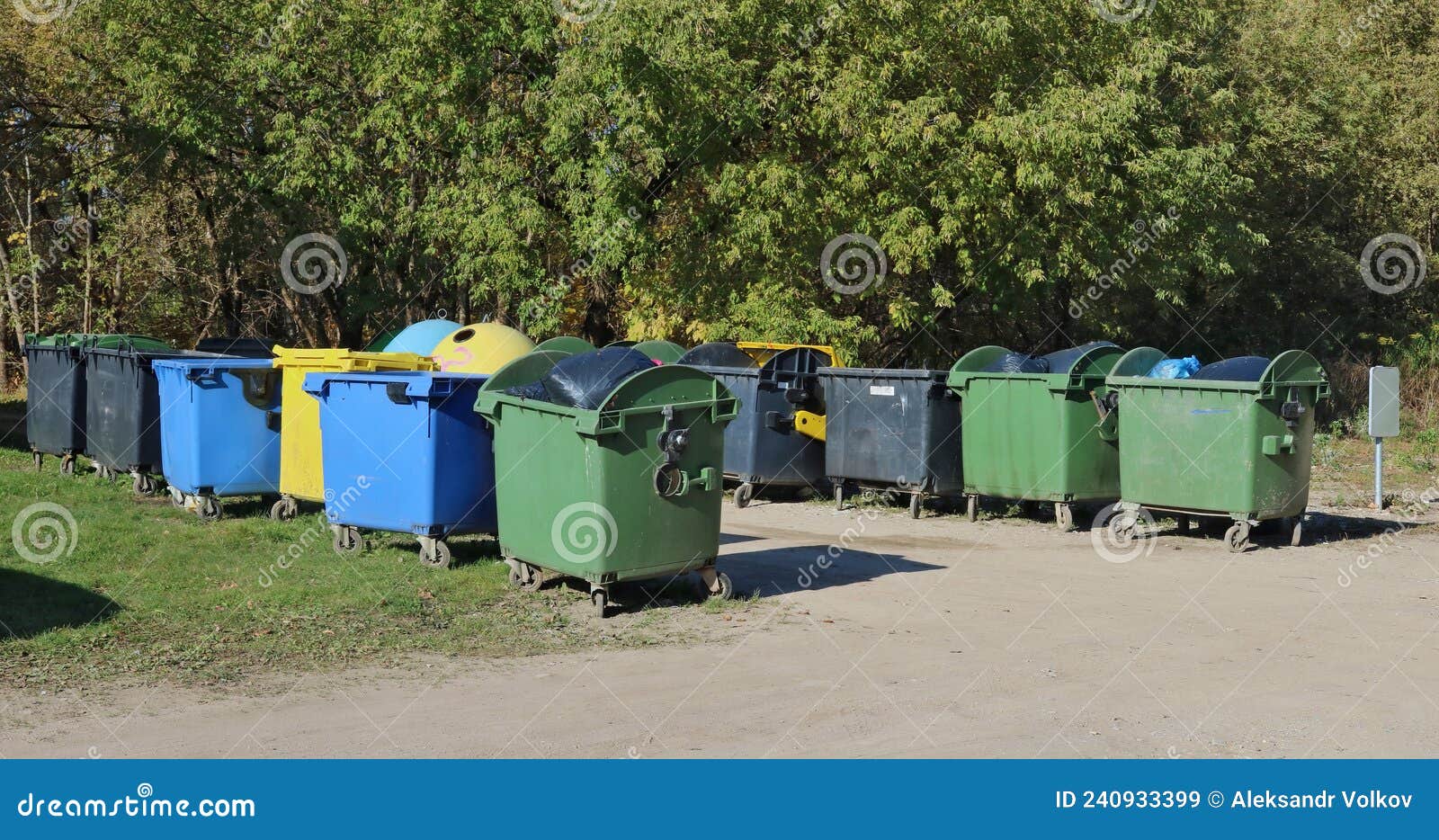 Big Standard Isolated Plastic Trash Bins are Located Near Forest Stock