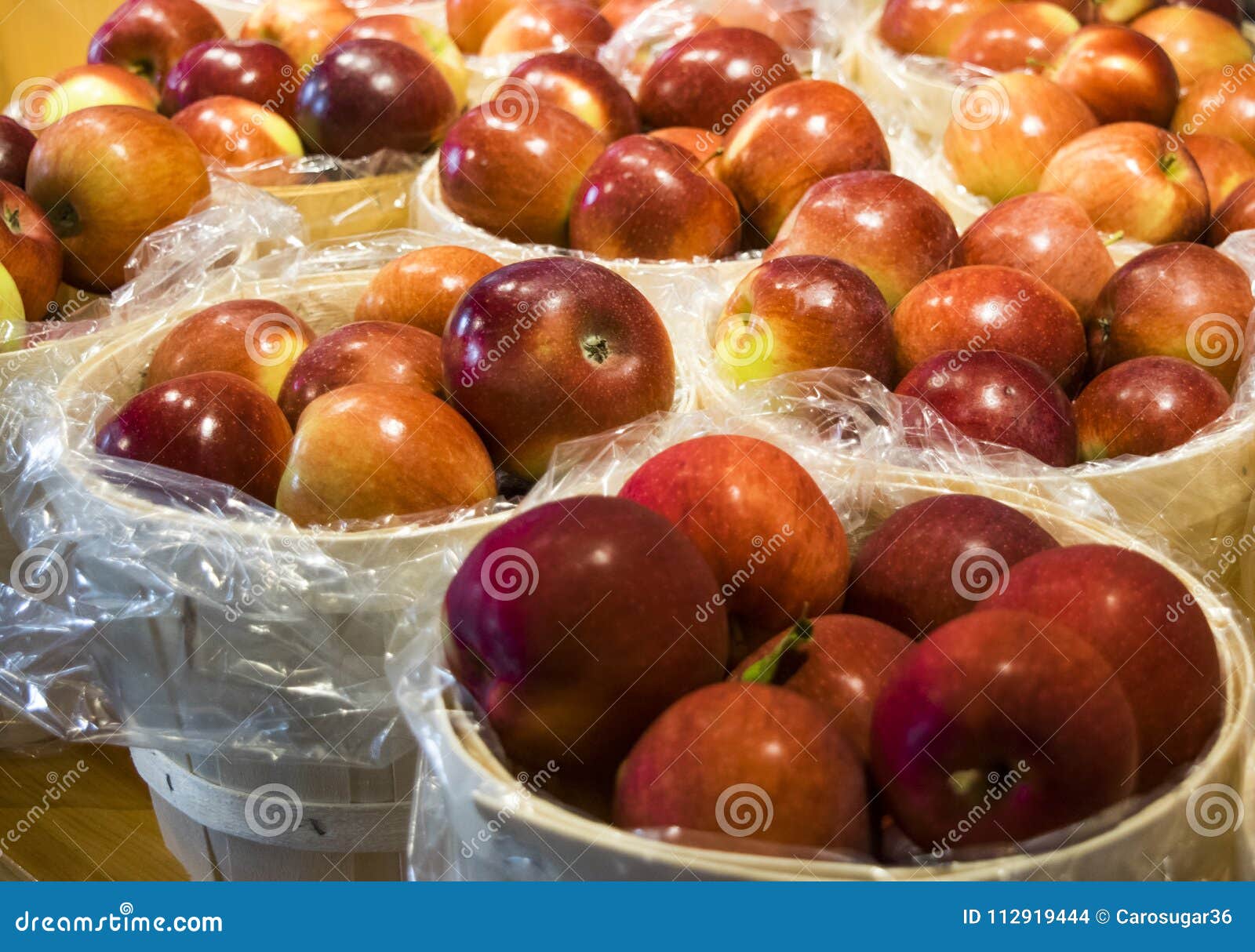 big and tasty red apples in baskets