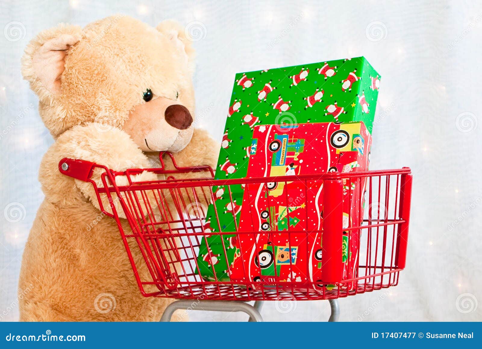Big Teddy Bear With Shopping Cart And Presents Royalty Free Stock Photography - Image: 17407477
