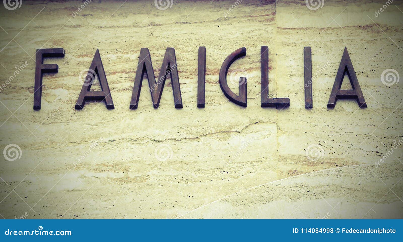 big text famiglia that means famiyl in italy language with copy