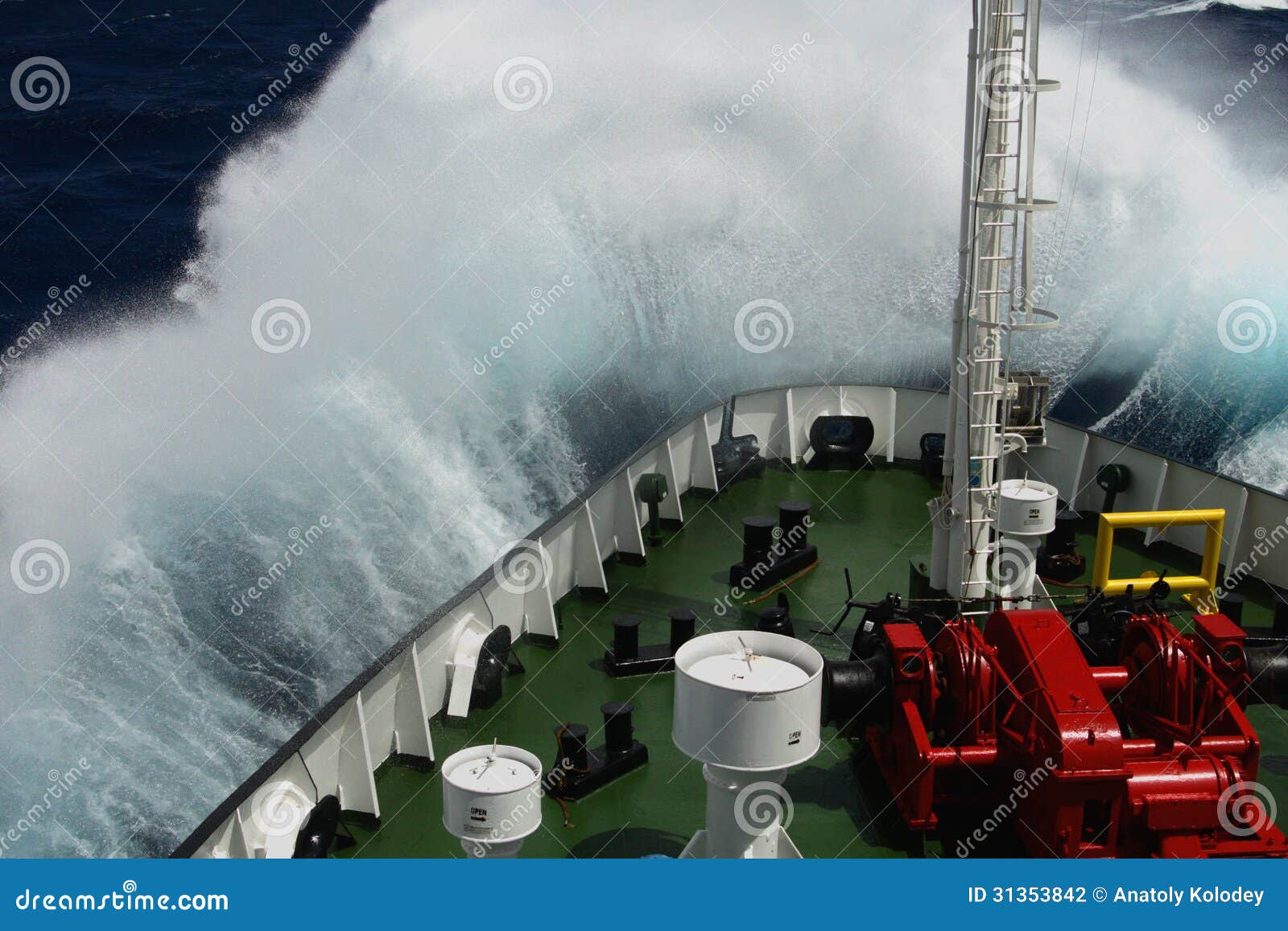 big wave rolling over the snout of the ship