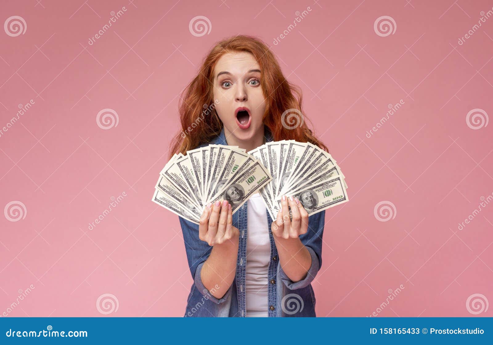 Shocked Redhead Girl Holding Lots of Money and Shouting Stock Image ...