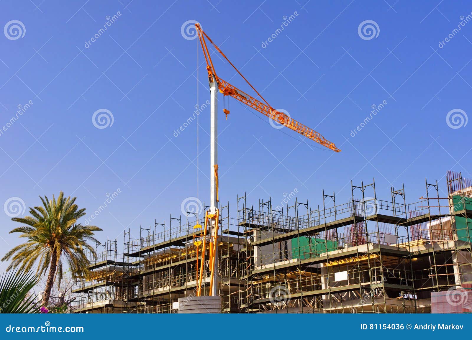 big yellow hoisting crane