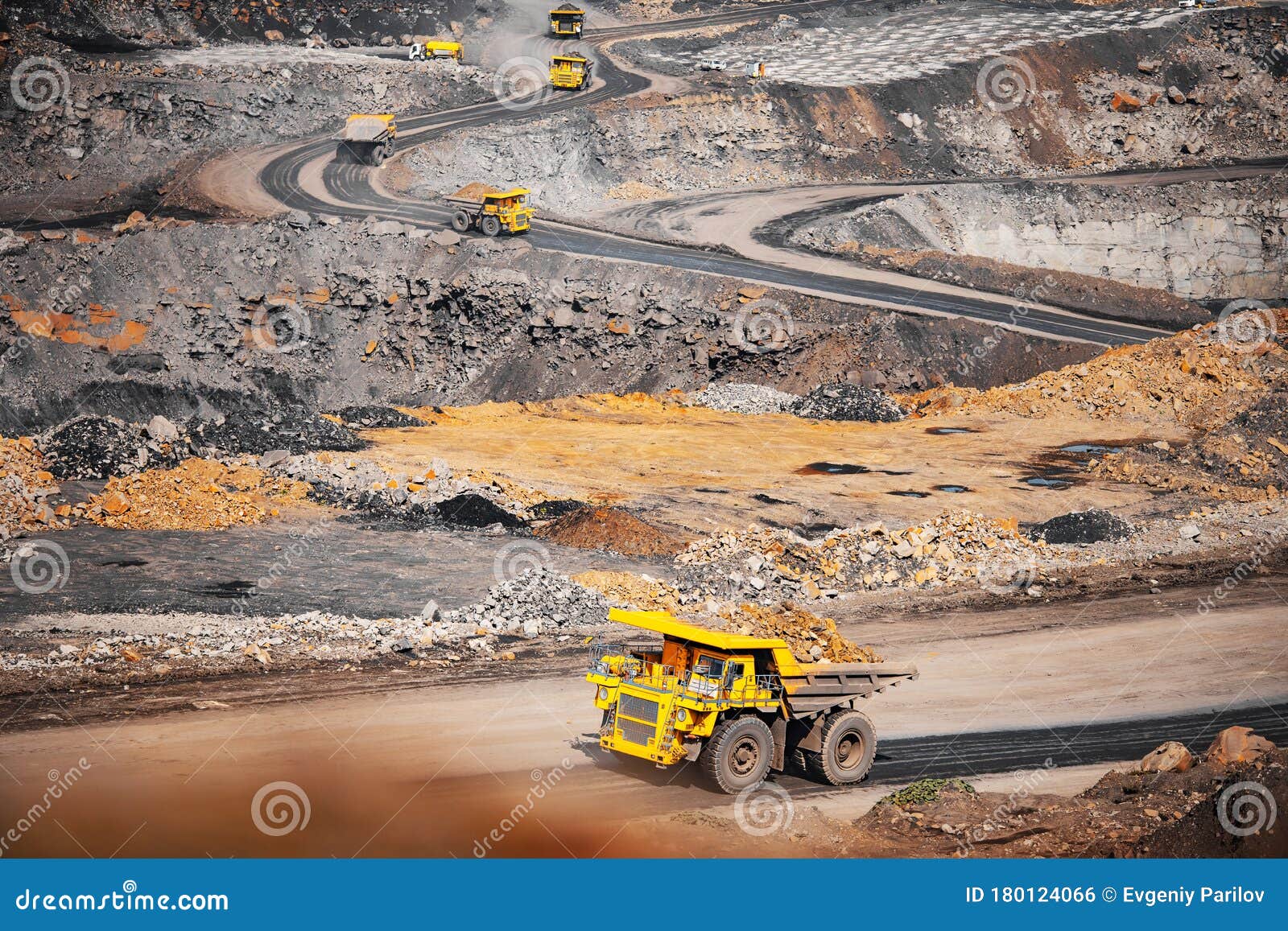big yellow mining truck transportation of gold ore. open pit mine industry