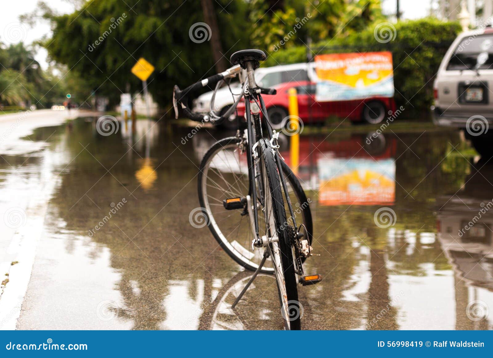 Bike after heavy rain stock image. Image of pavement 56998419