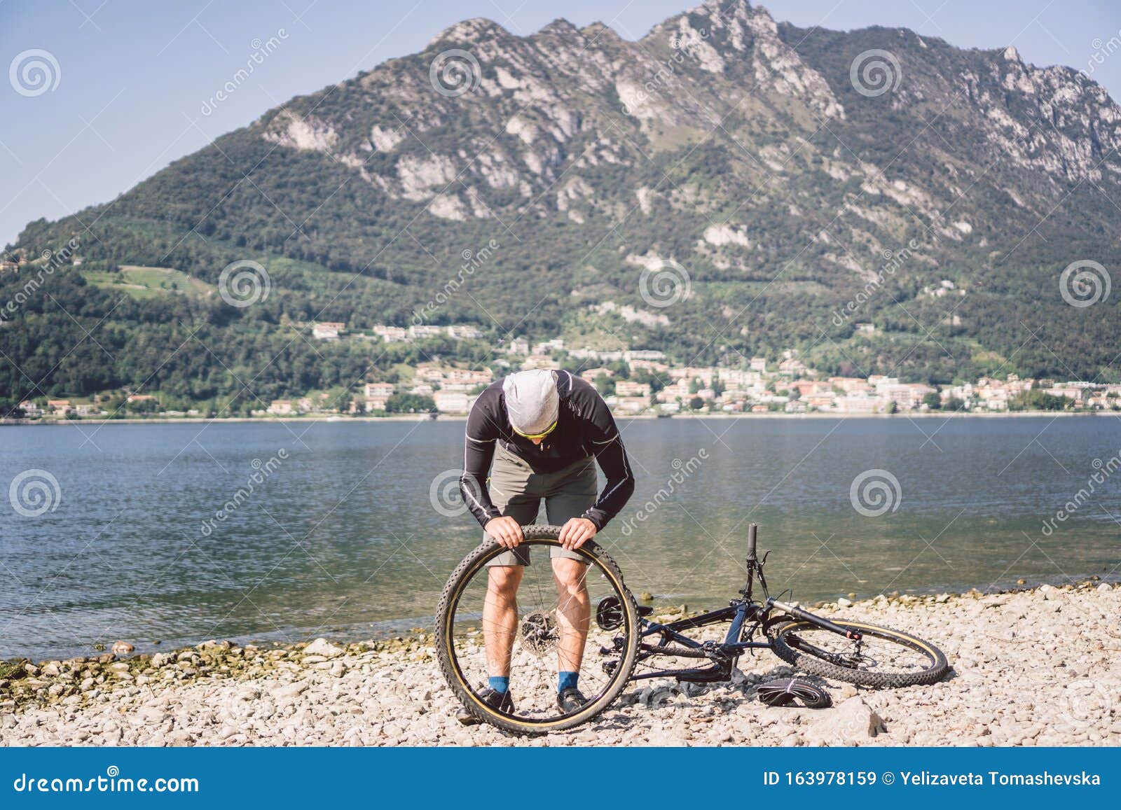 Bike Repair Man Repairing Mountain Bike Cyclist Man In Trouble Rear Wheel Wheel Case Of Accident Man Fixes Bike Near Stock Image Image Of Problem Biker