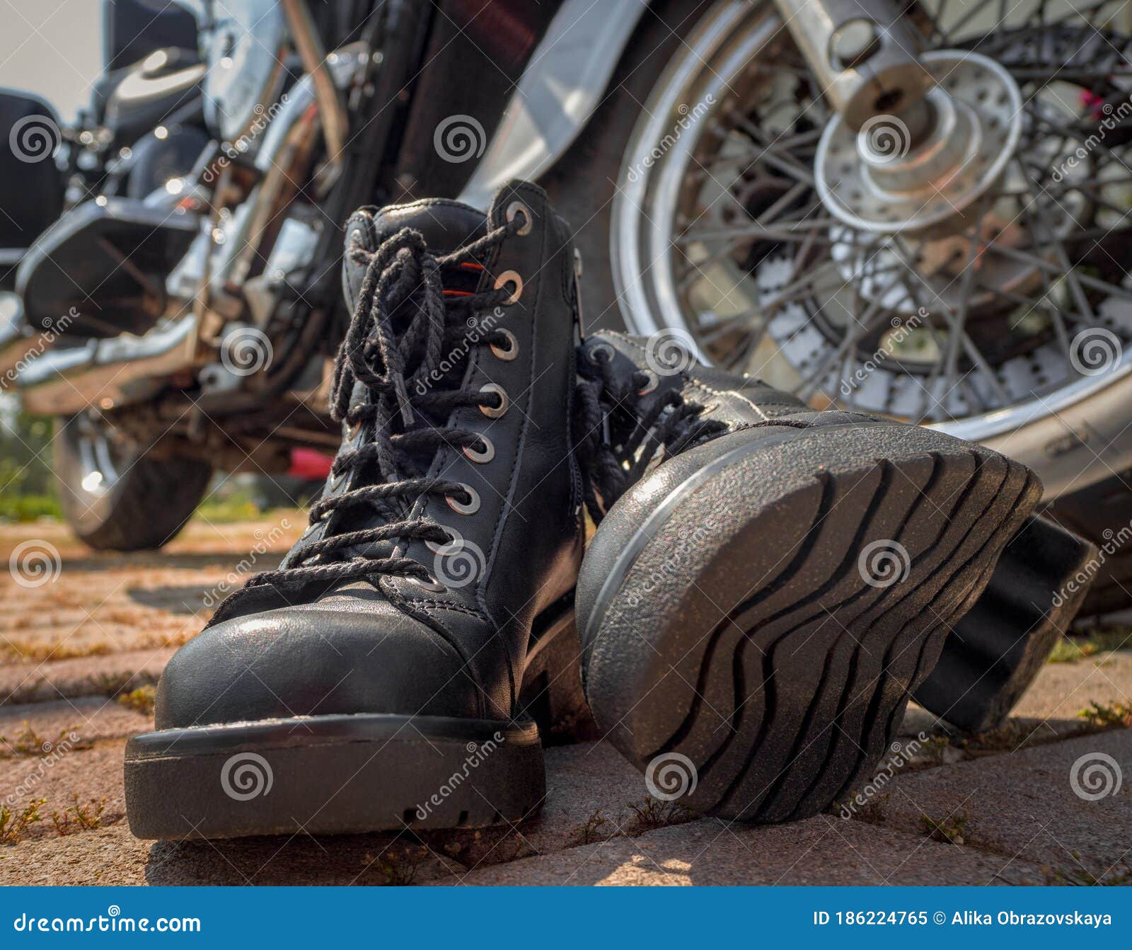 Biker Boots With Laces Close-up Standing Near The Wheel Of A Motorcycle ...
