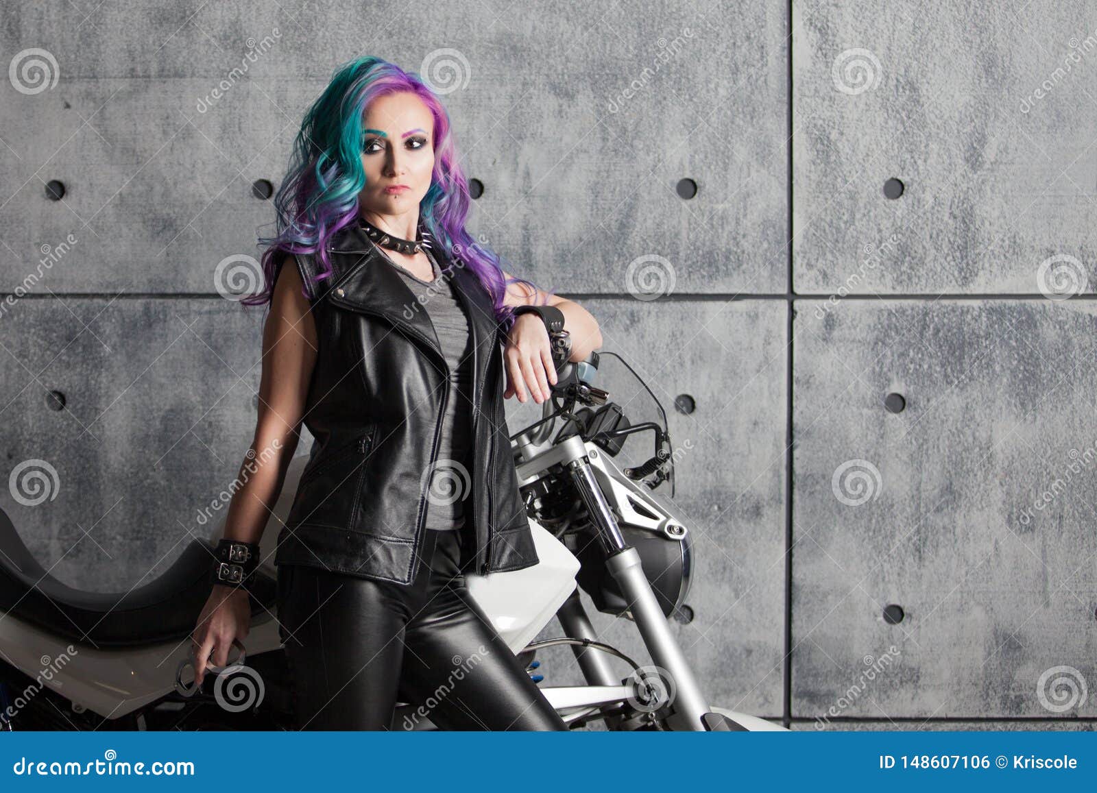 Biker Chick in Front of Motorcycle. Beautiful and Pert Young Woman in  Leather Clothes Stock Photo - Image of beauty, model: 148607106