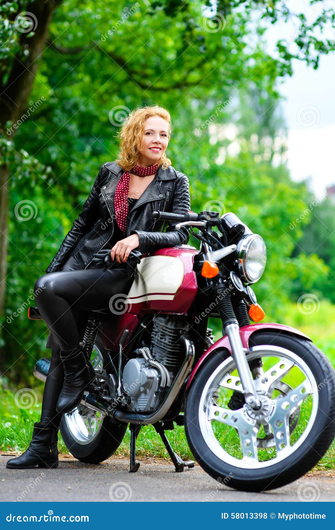 Biker Girl In Leather Jacket On A Motorcycle Stock Photo ...