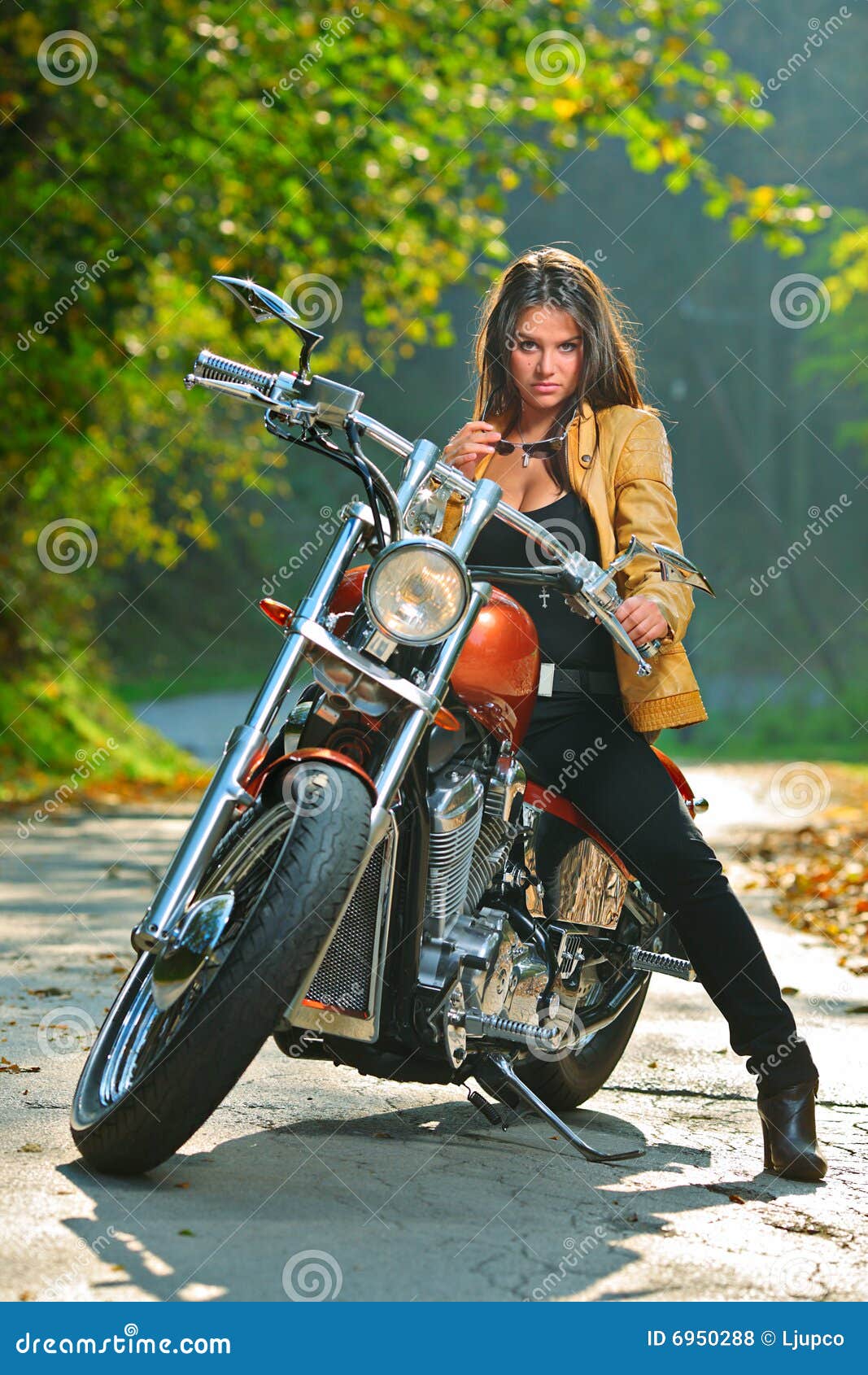 Biker girl on a motorcycle stock photo. Image of jacket - 6950288