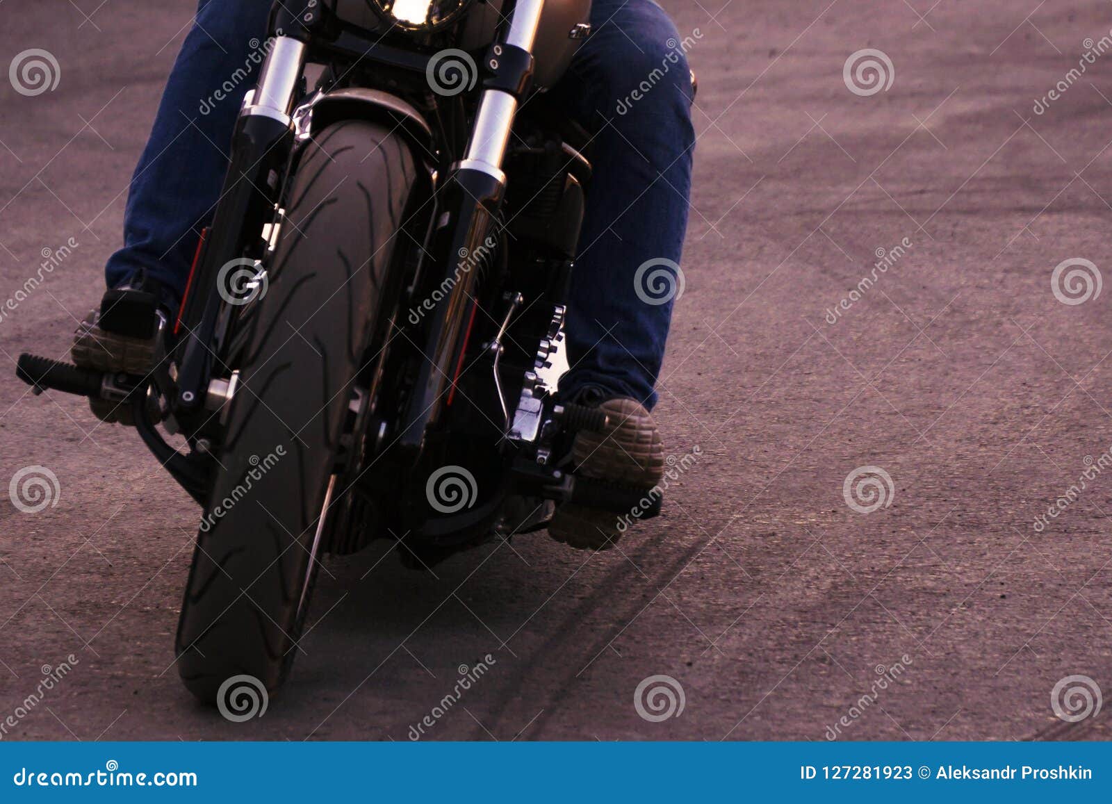 biker iriding a motorcycle. front view