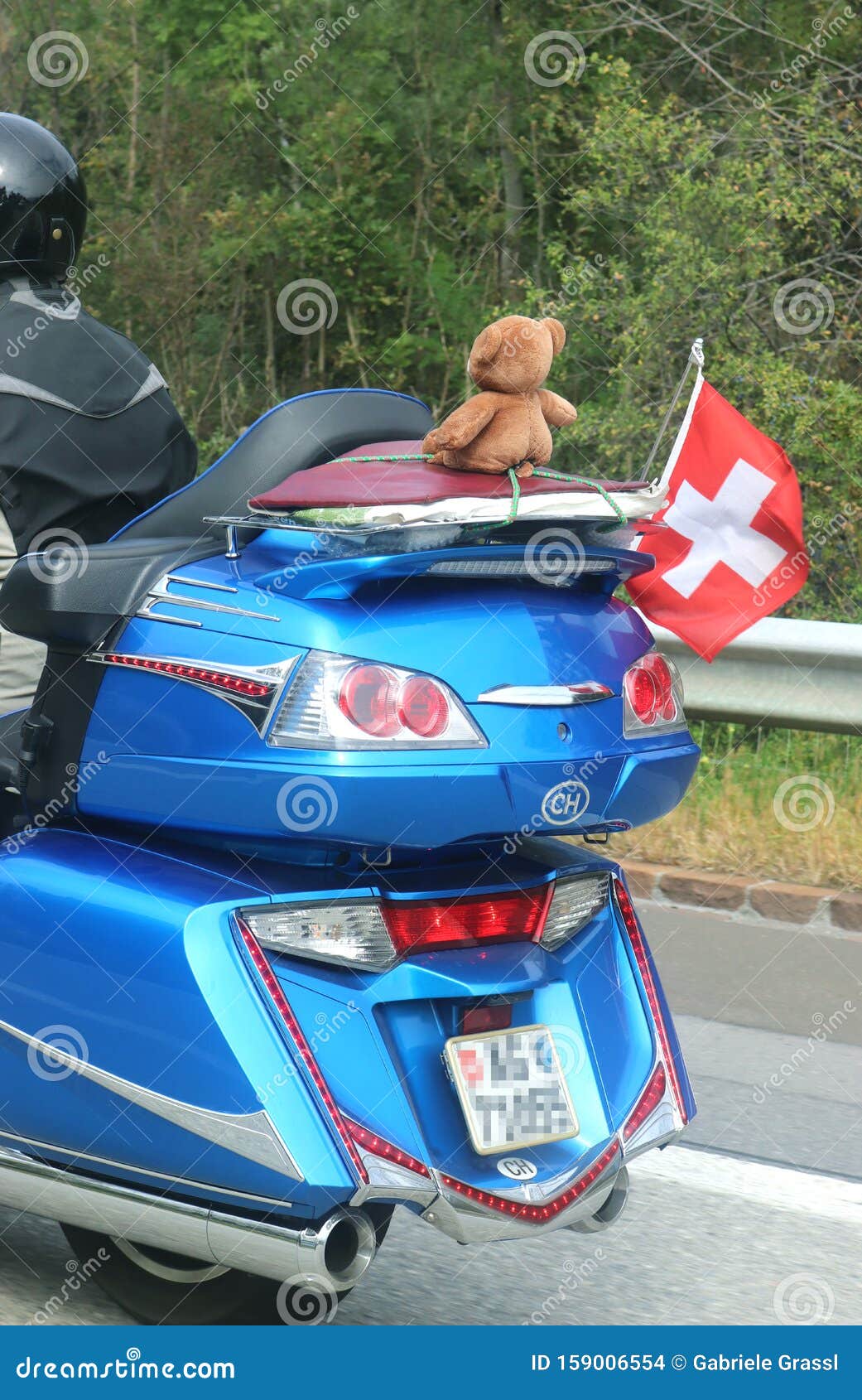 Biker with a Large Motorcycle Decorated with a Swiss Lag and a Teddy ...