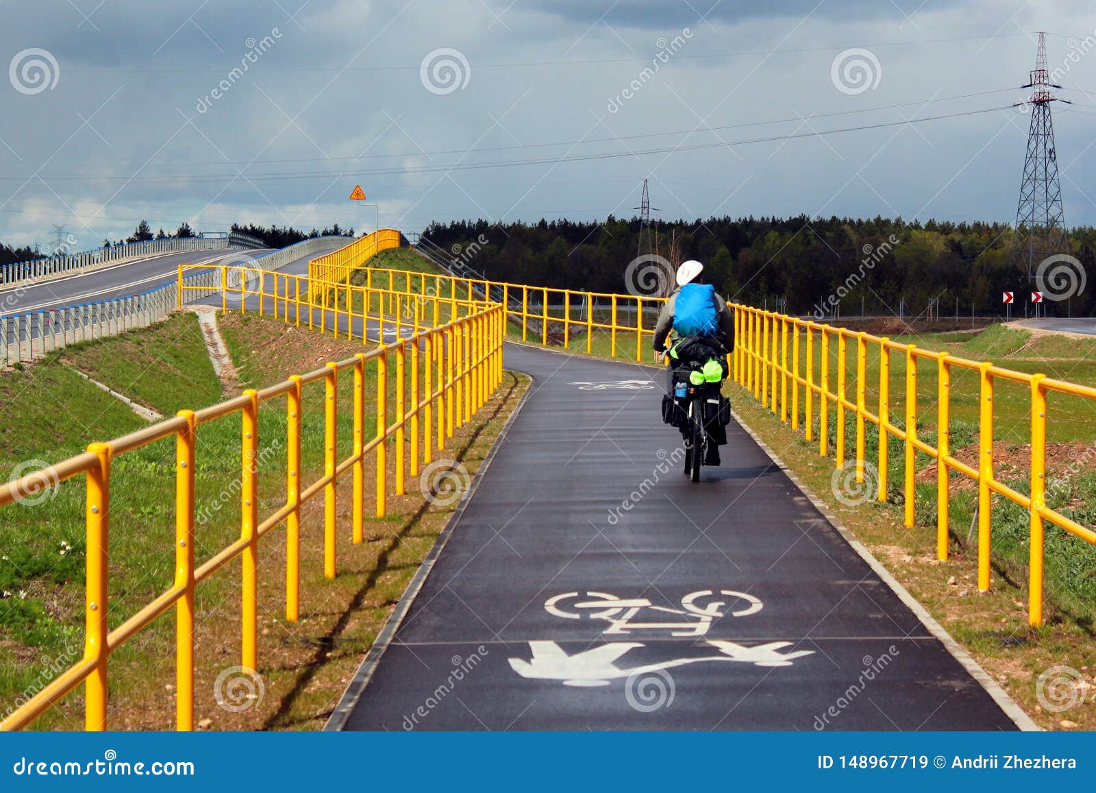a biker riding on green velo bicycle route, the longest consistently marked cycle trail in eastern poland