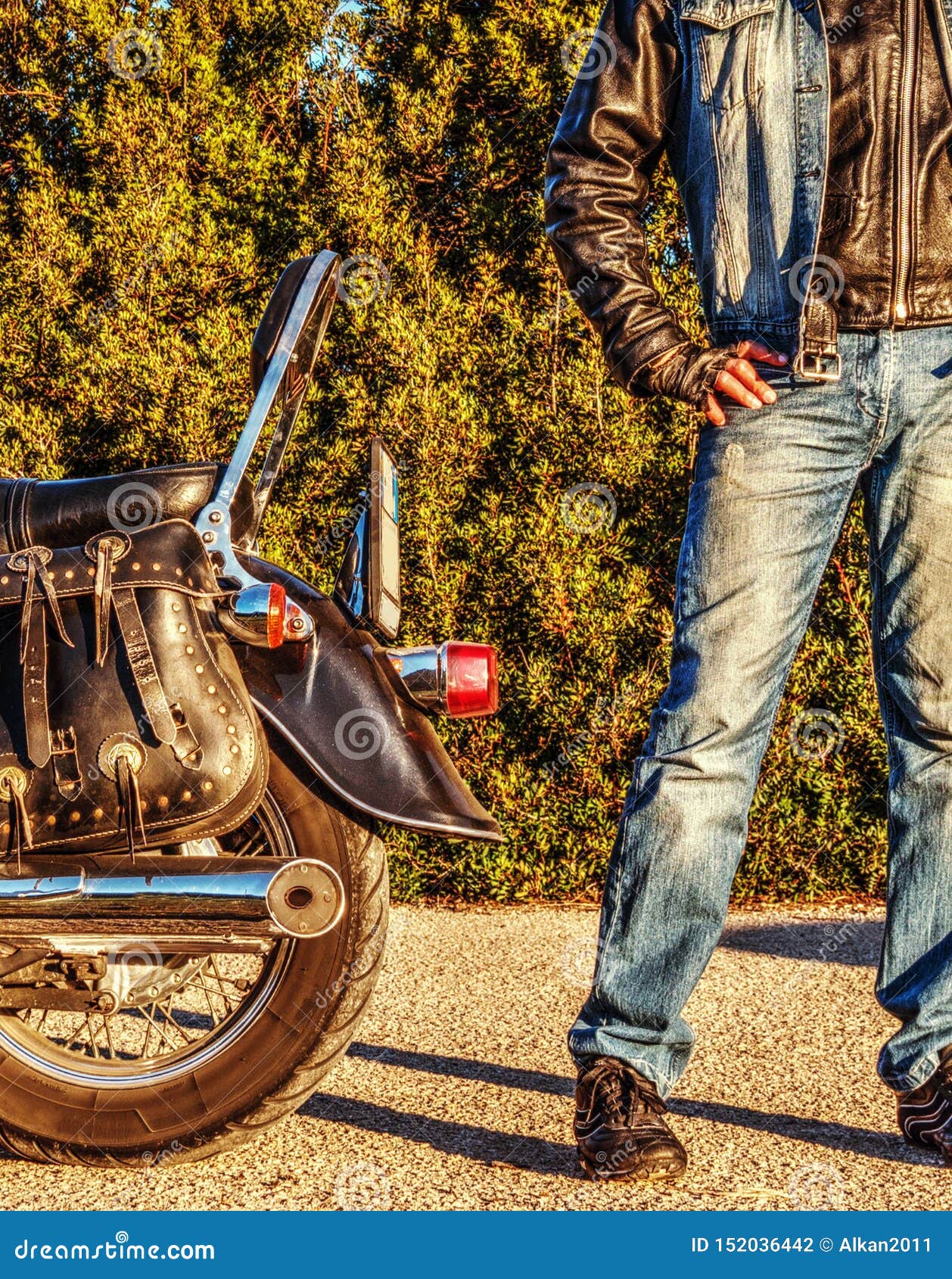 Biker Standing by a Classic Motorcycle Stock Photo Image of route