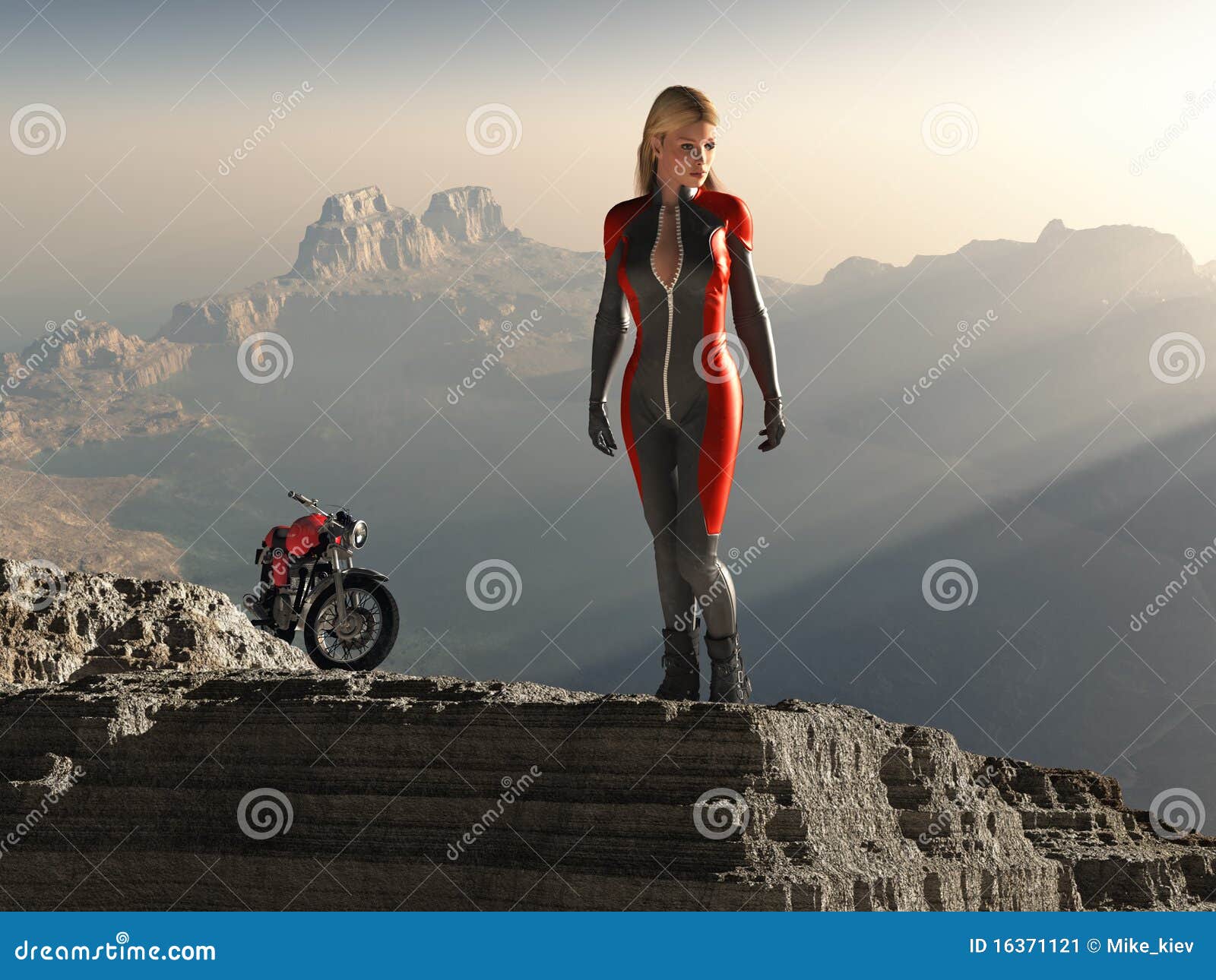 biker woman on mountain peak