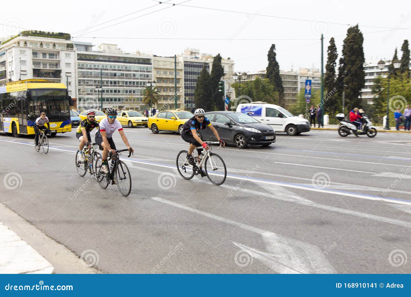 bikers pedaling on the streets of athens city