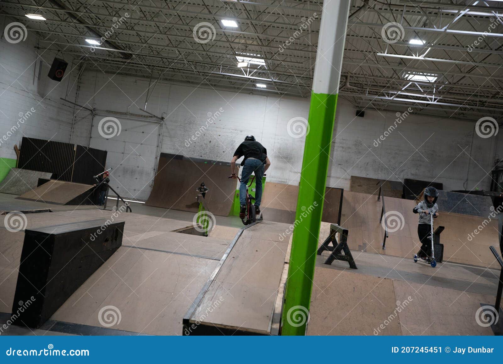 Bikers and Skaters are Practicing Their Tricks Inside Editorial Photo