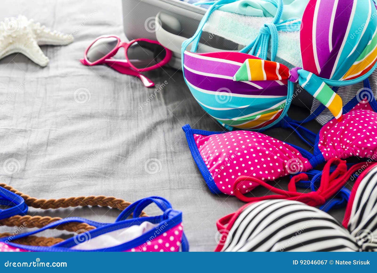 Bikinis and Clothes in Luggage on the Bed Stock Image - Image of ...