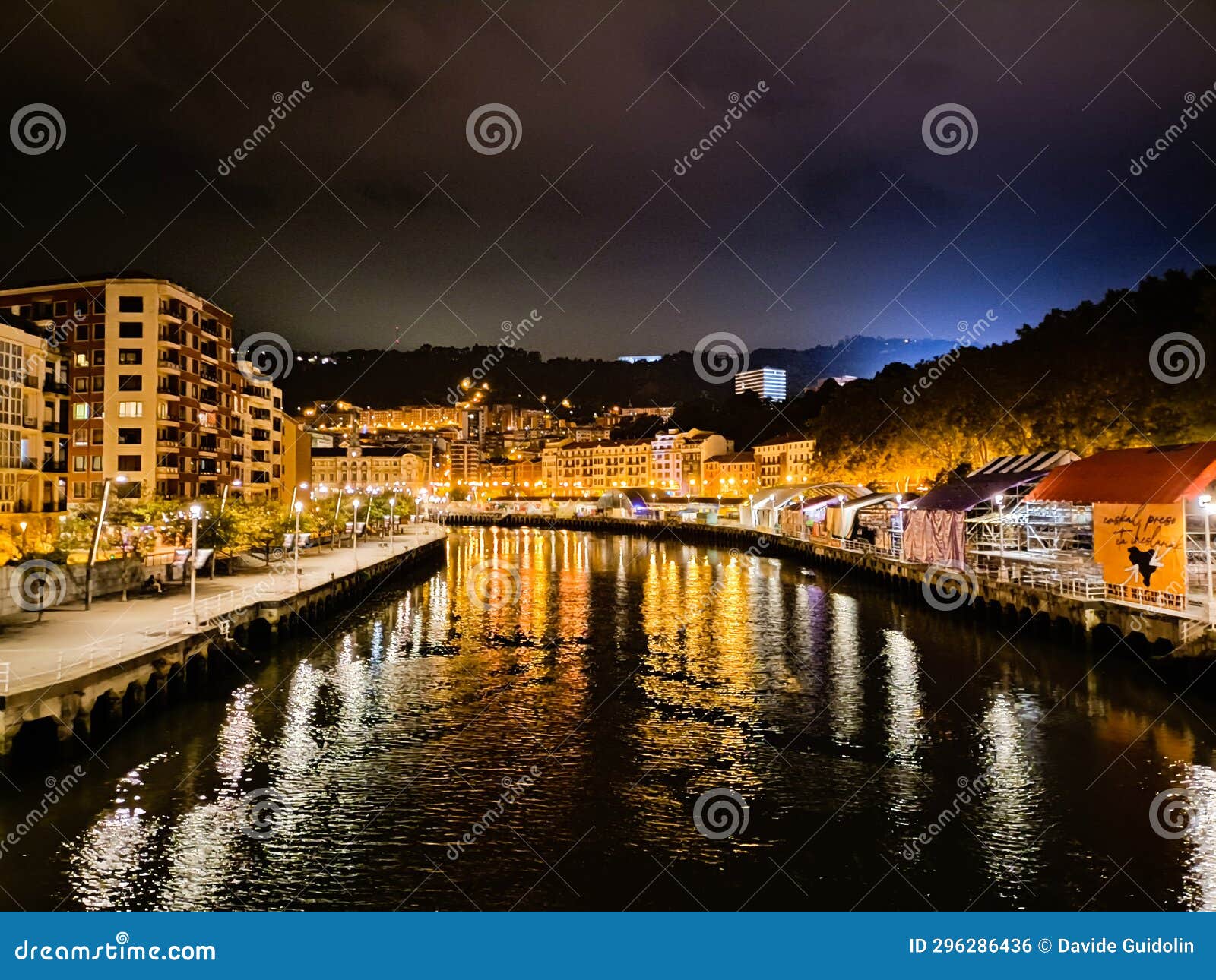 bilbao night view. nervion river perpective view, spain