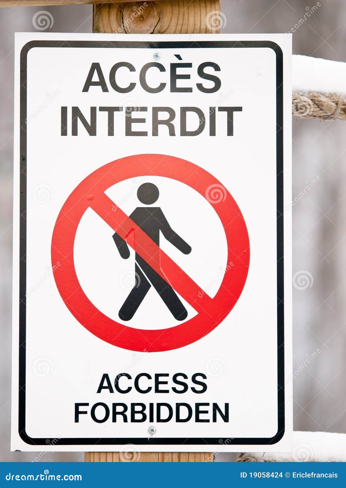 bilingual access forbiden sign