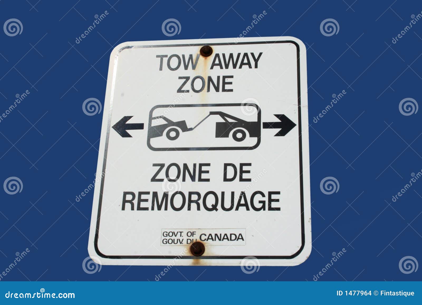 bilingual tow away zone sign