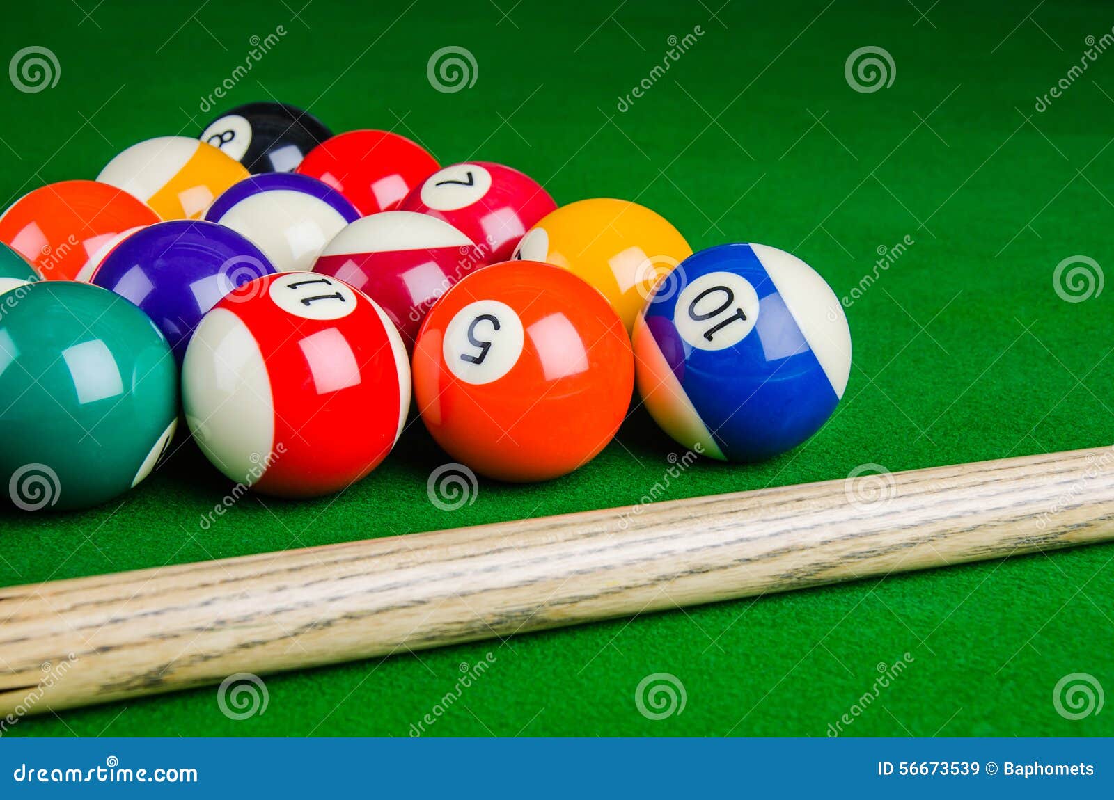 Billiard Balls on Green Table with Billiard Cue, Snooker, Pool. Stock
