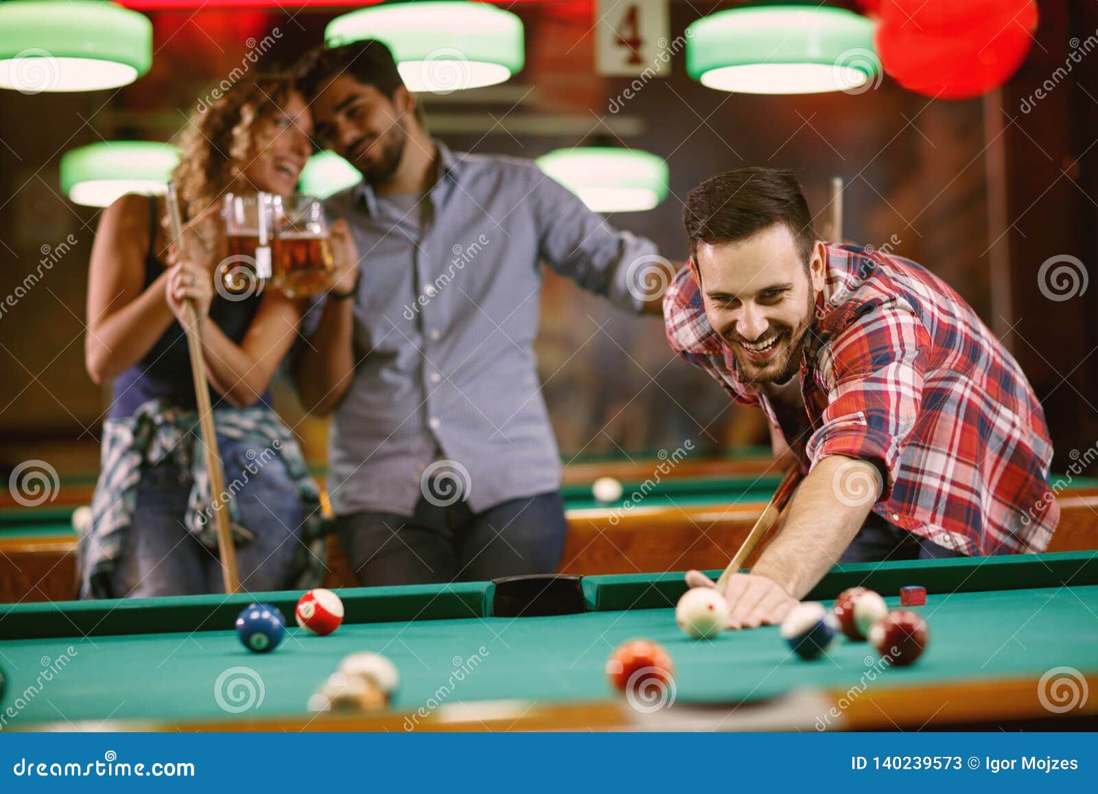 Billiard Game Man Enjoying Playing Pool with Friends Stock Image