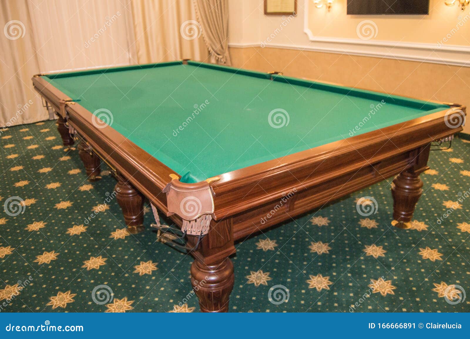 Billiard Table With Green Baize Stands In A Luxurious Living Room