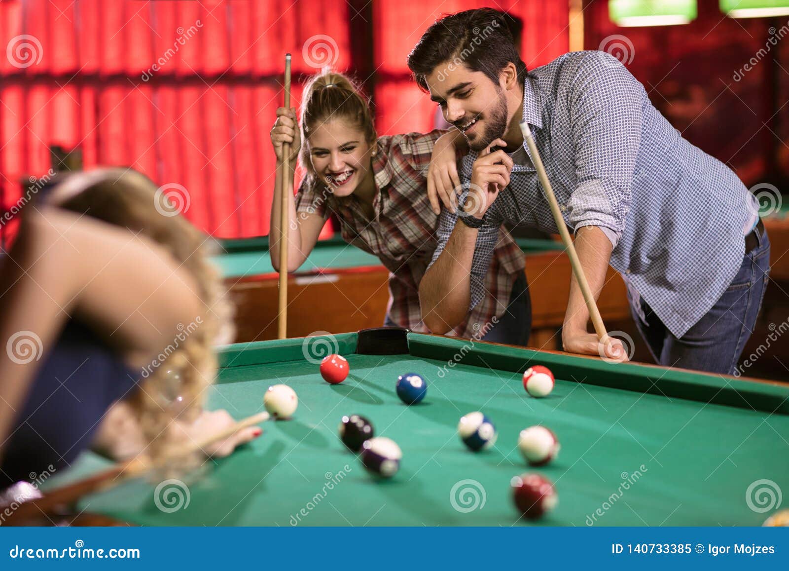 Billiards Game. Group of Friends Playing Pool Together Stock Image