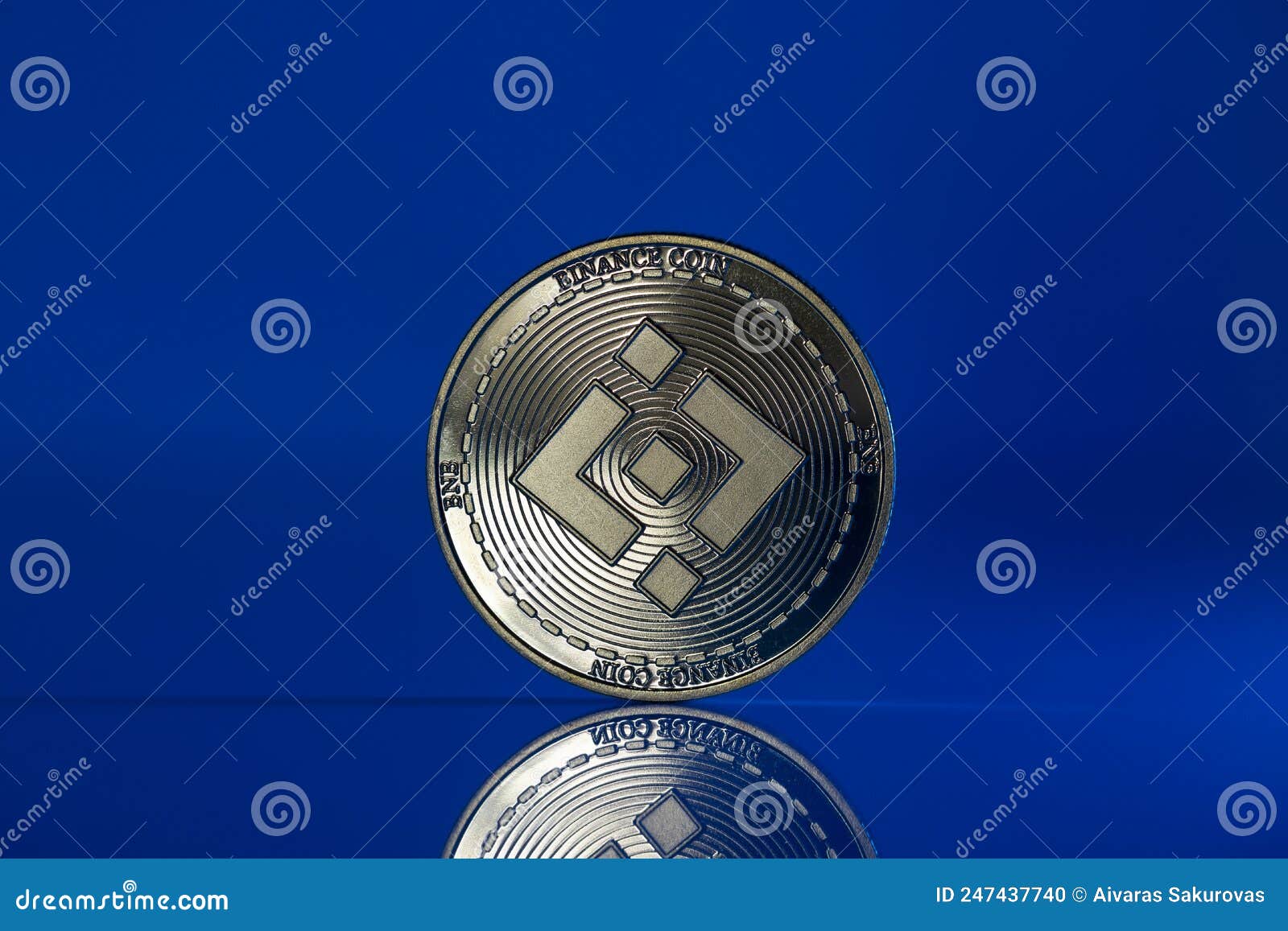 Binance Bnb Crypto Coin Placed On Reflective Surface And Lit With Blue Light Editorial Image