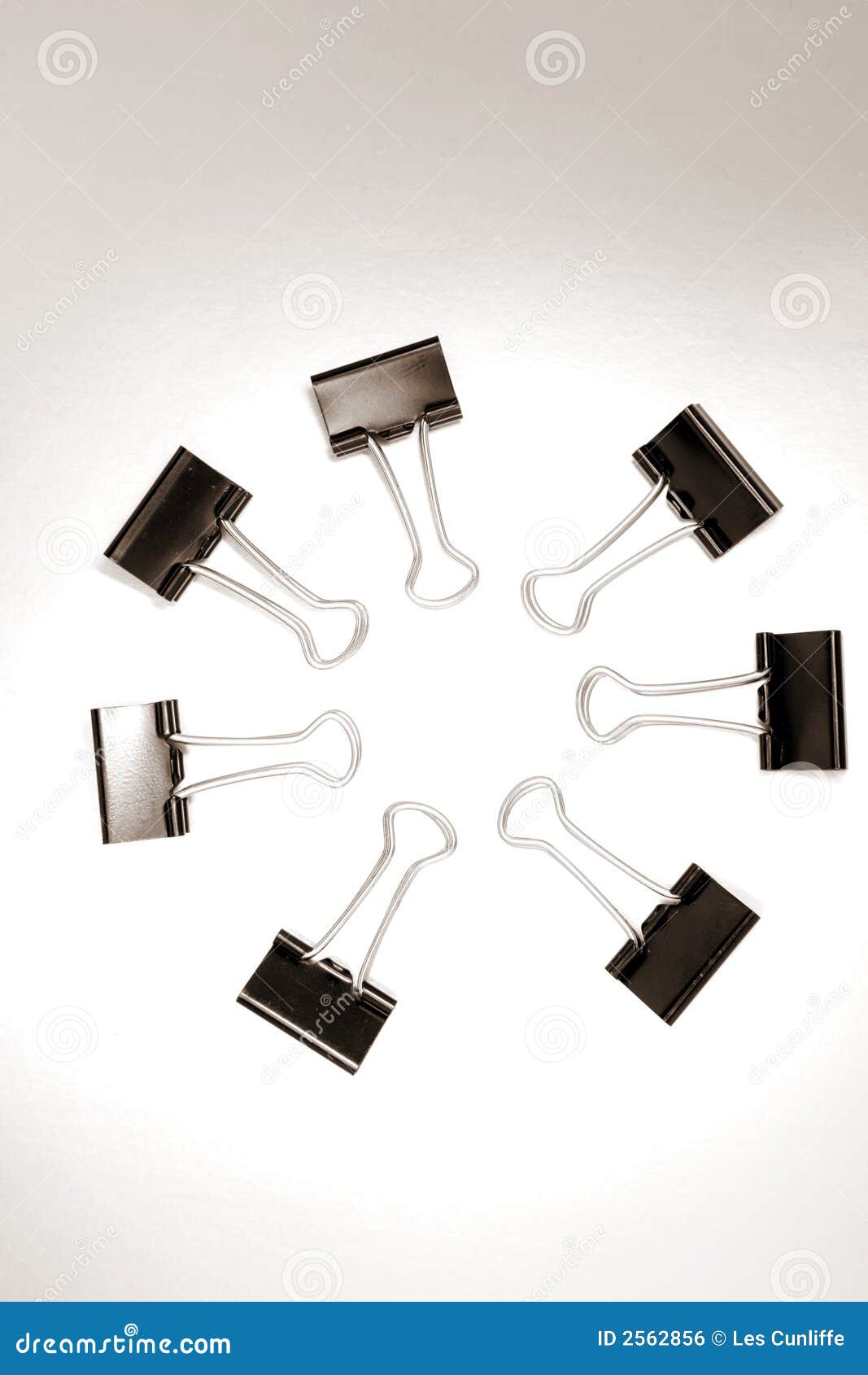 Binder clips in circle stock photo. Image of employees 2562856