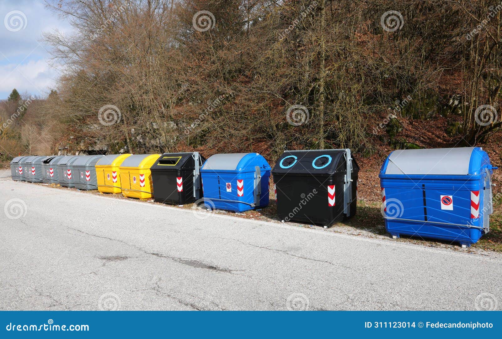 bins for the separate collection of waste in the ecological area for the management of waste materials on the road
