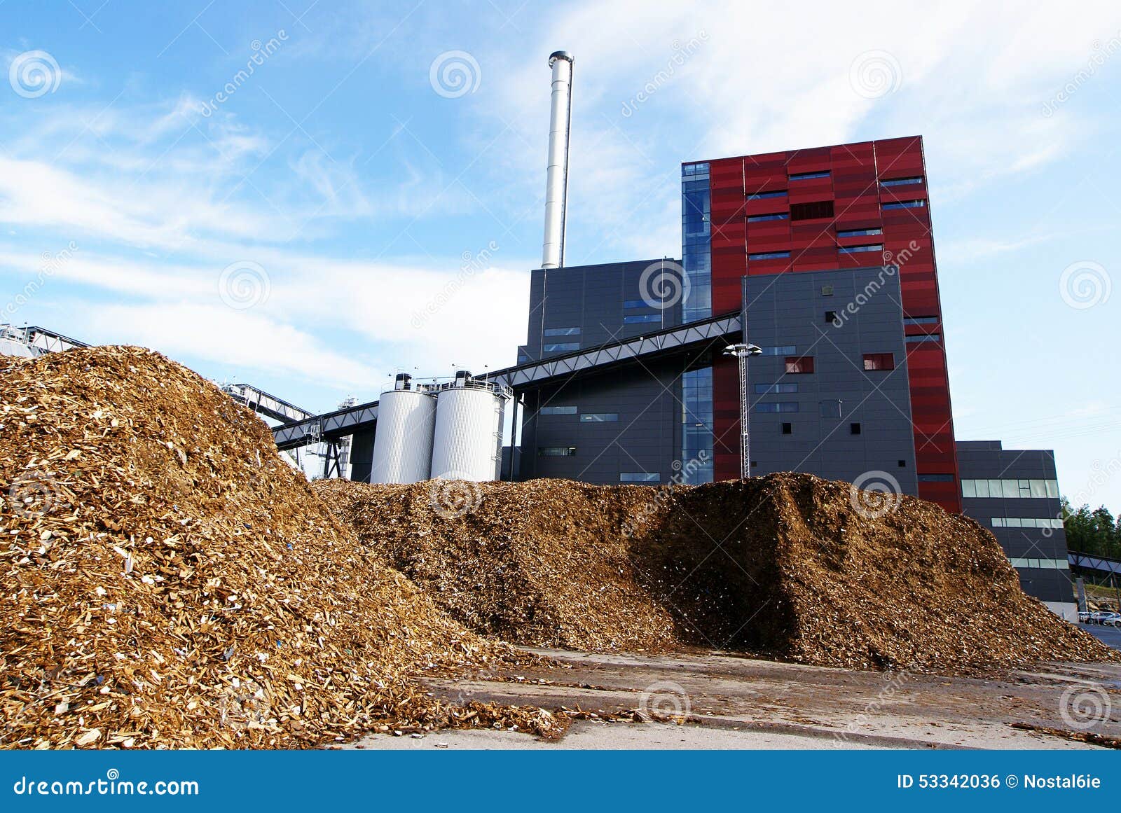 bio power plant and storage of wooden fuel (biomass) against bl