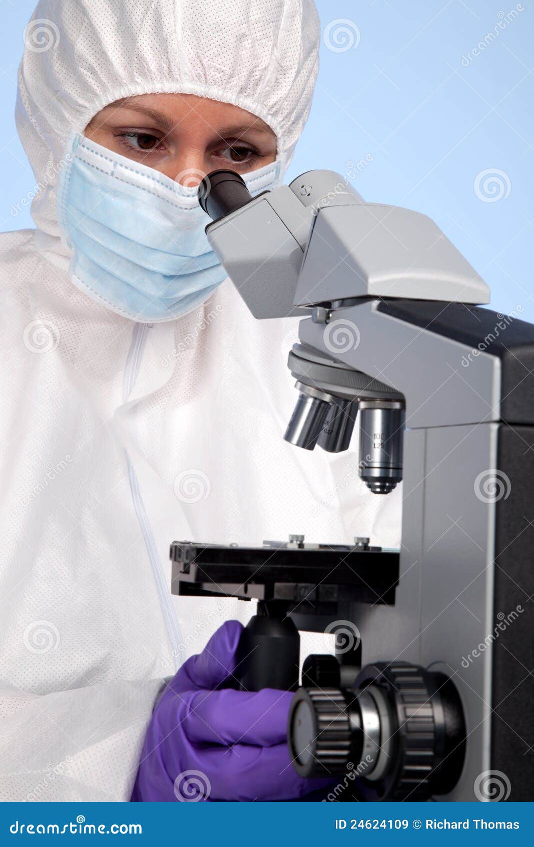 biochemist using a stereo microscope