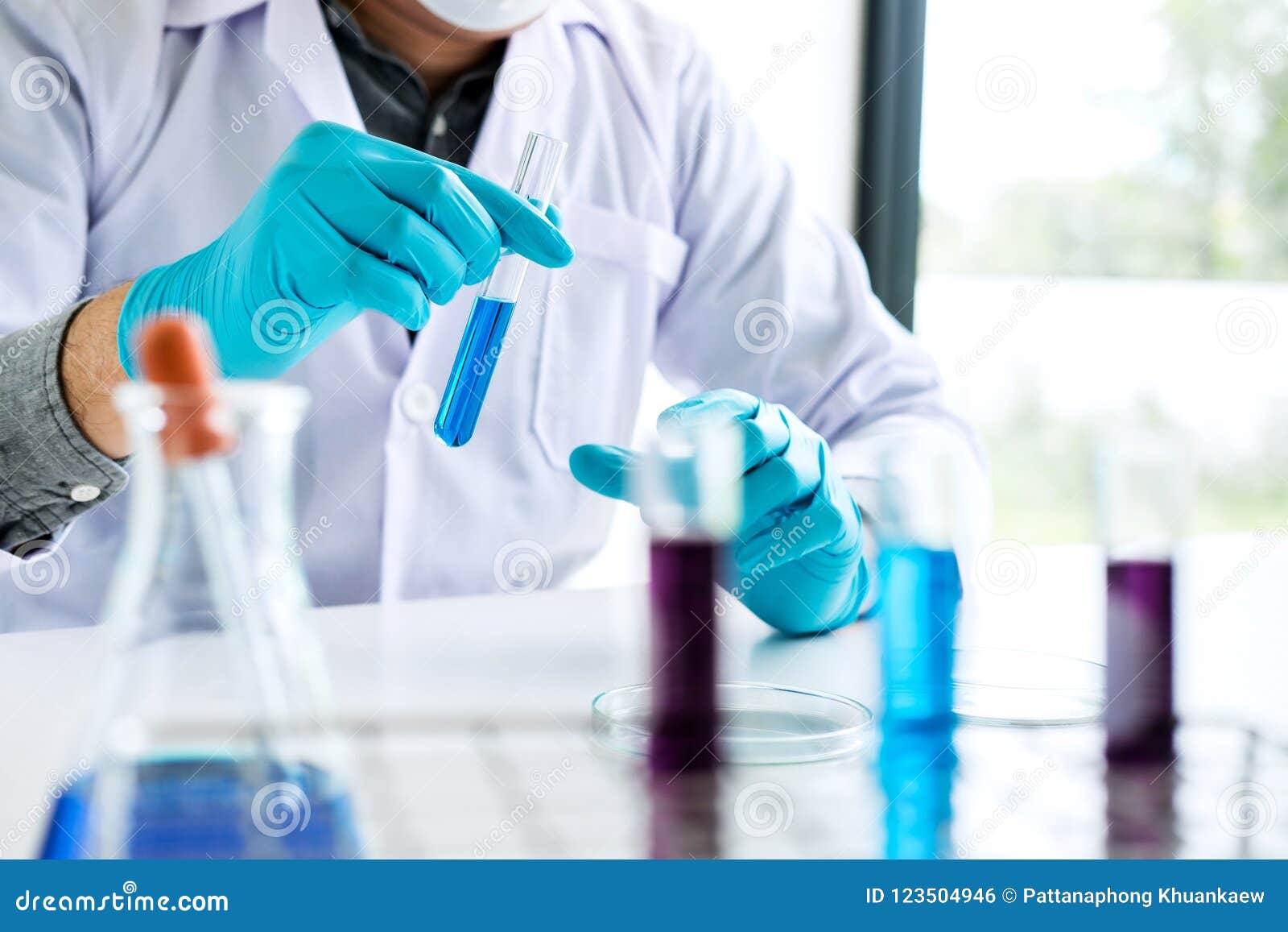Biochemistry Laboratory Research, Chemist is Analyzing Sample in Stock
