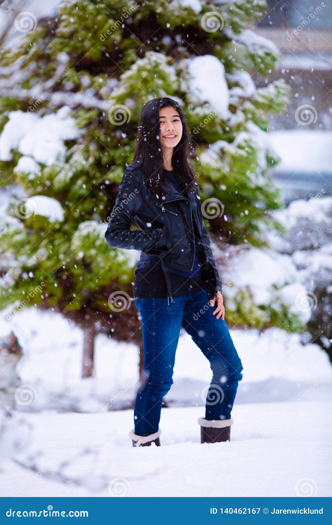 Teen Girl Outdoors during Snowfall Wearing Black Leather Jacket Stock ...