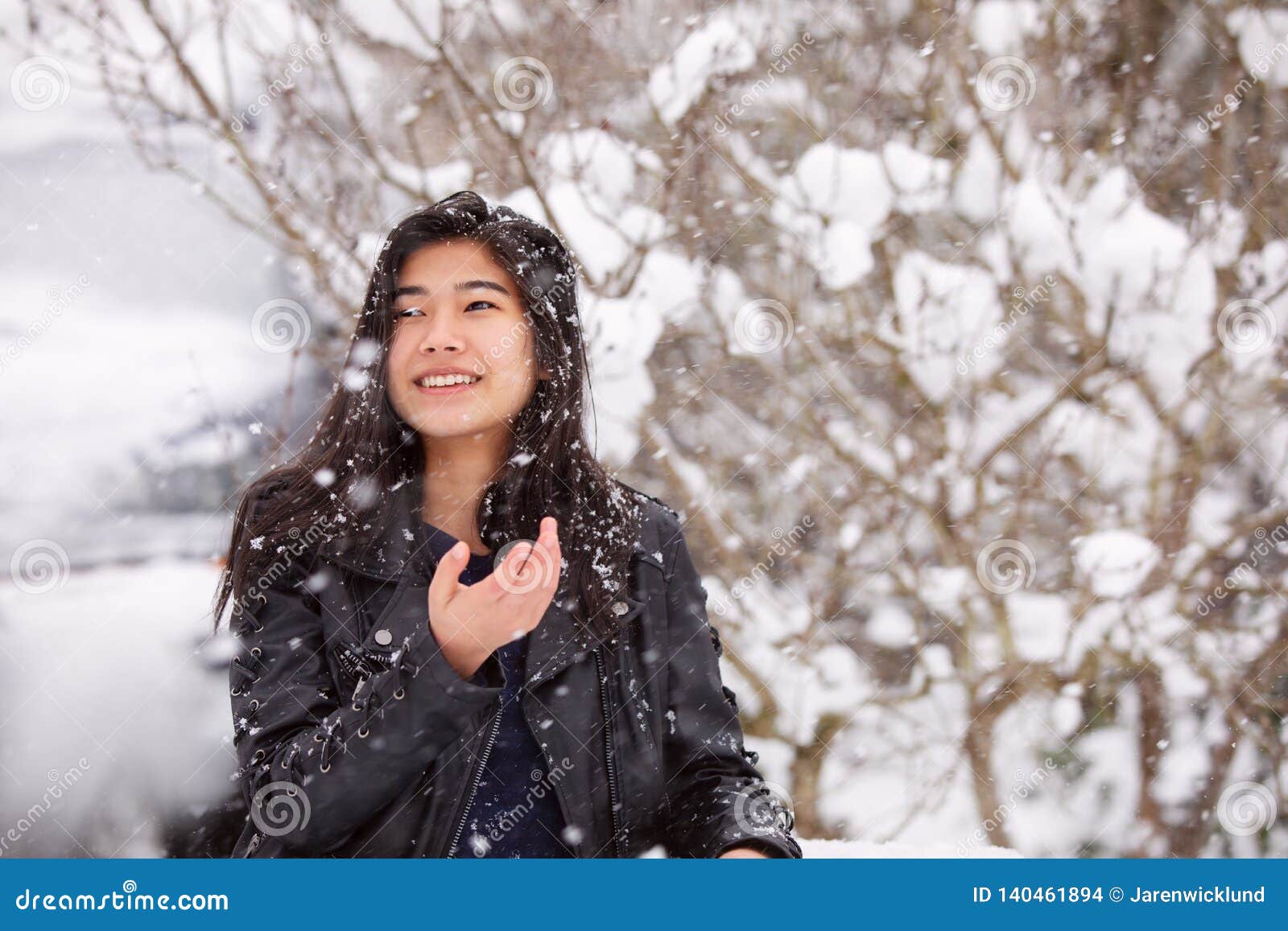 Teen Girl Outdoors during Snowfall Wearing Black Leather Jacket Stock ...