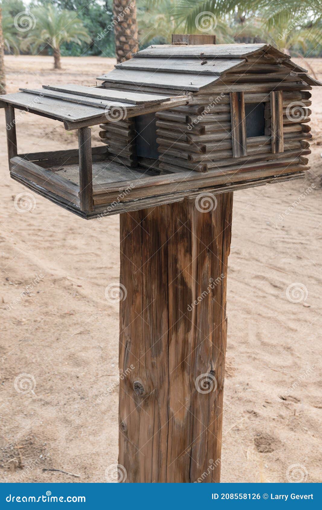 Bird feeder on a post stock photo. Image of colored 208558126