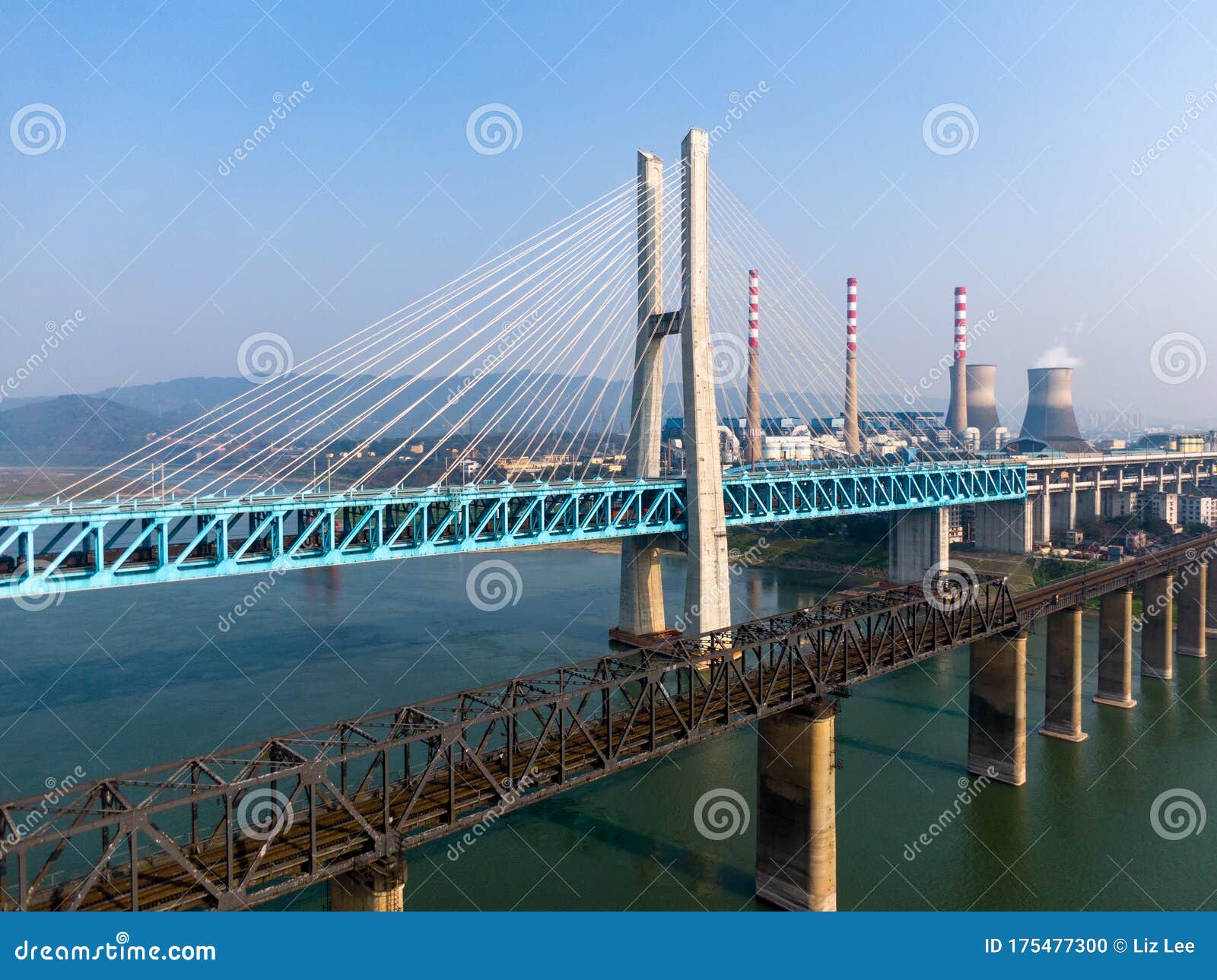 bird view of old and new baishatuo yangtze river railway bridge under blue sky