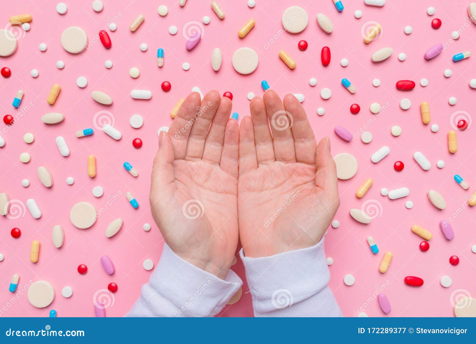 Birth Control Concept with Cupped Hands Above Pills Stock Image Image