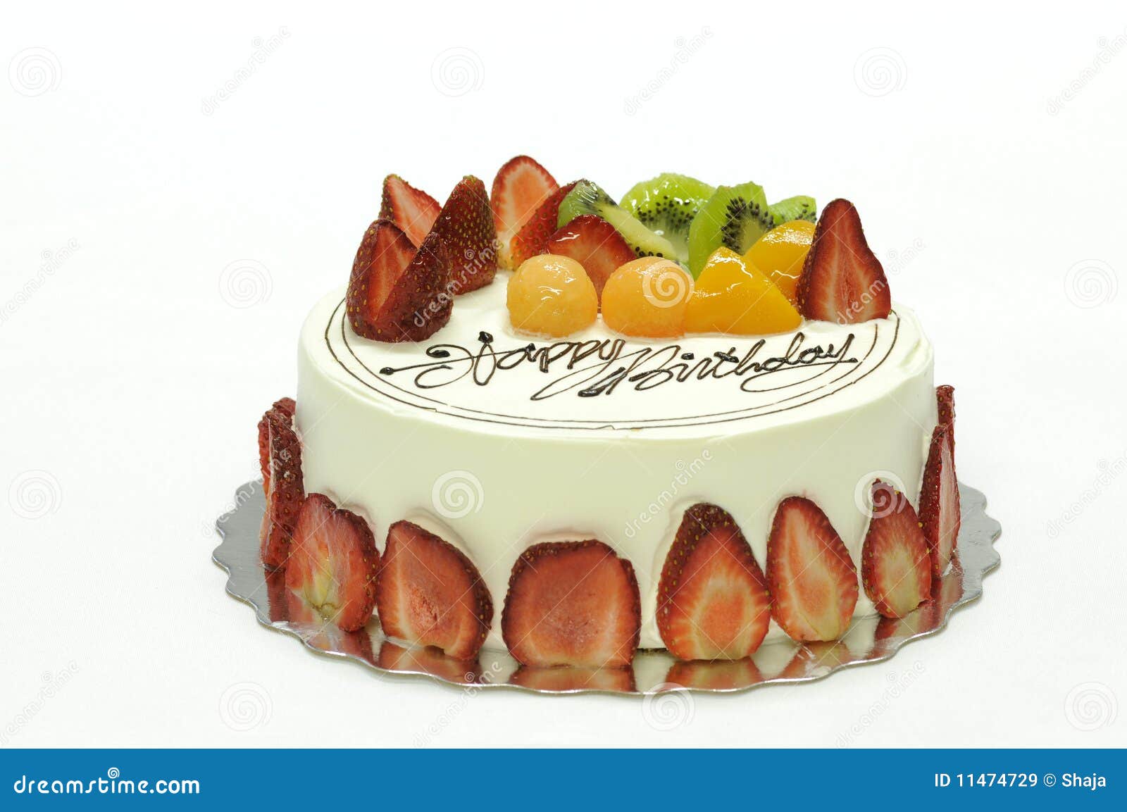 Tasty colorful fruit cake with happy birthday on it