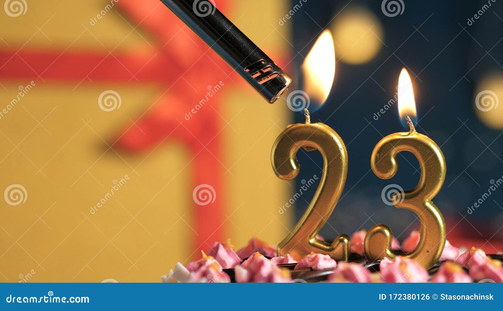 Birthday Cake Number 23 Golden Candles Burning By Lighter Background Gift Yellow Box Tied Up With Red Ribbon Close Up Stock Photo Image Of Gold Close