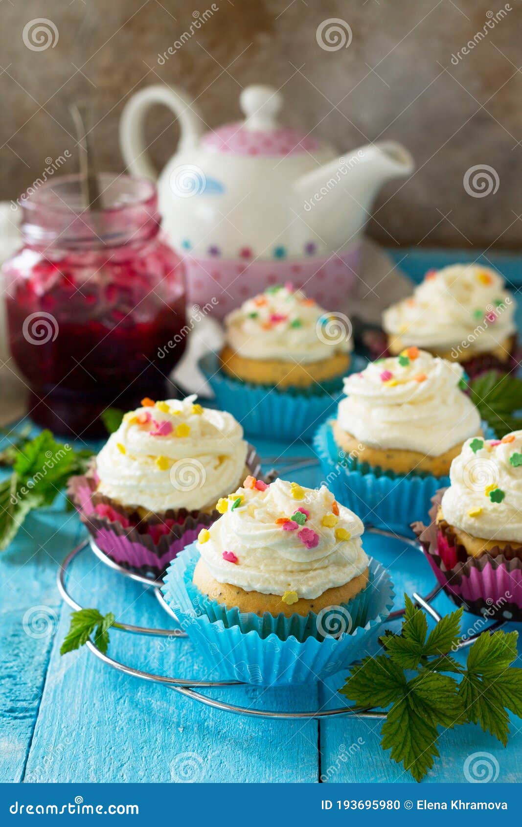 Birthday Cupcake with Buttercream Icing and Raspberry Jam a Wooden
