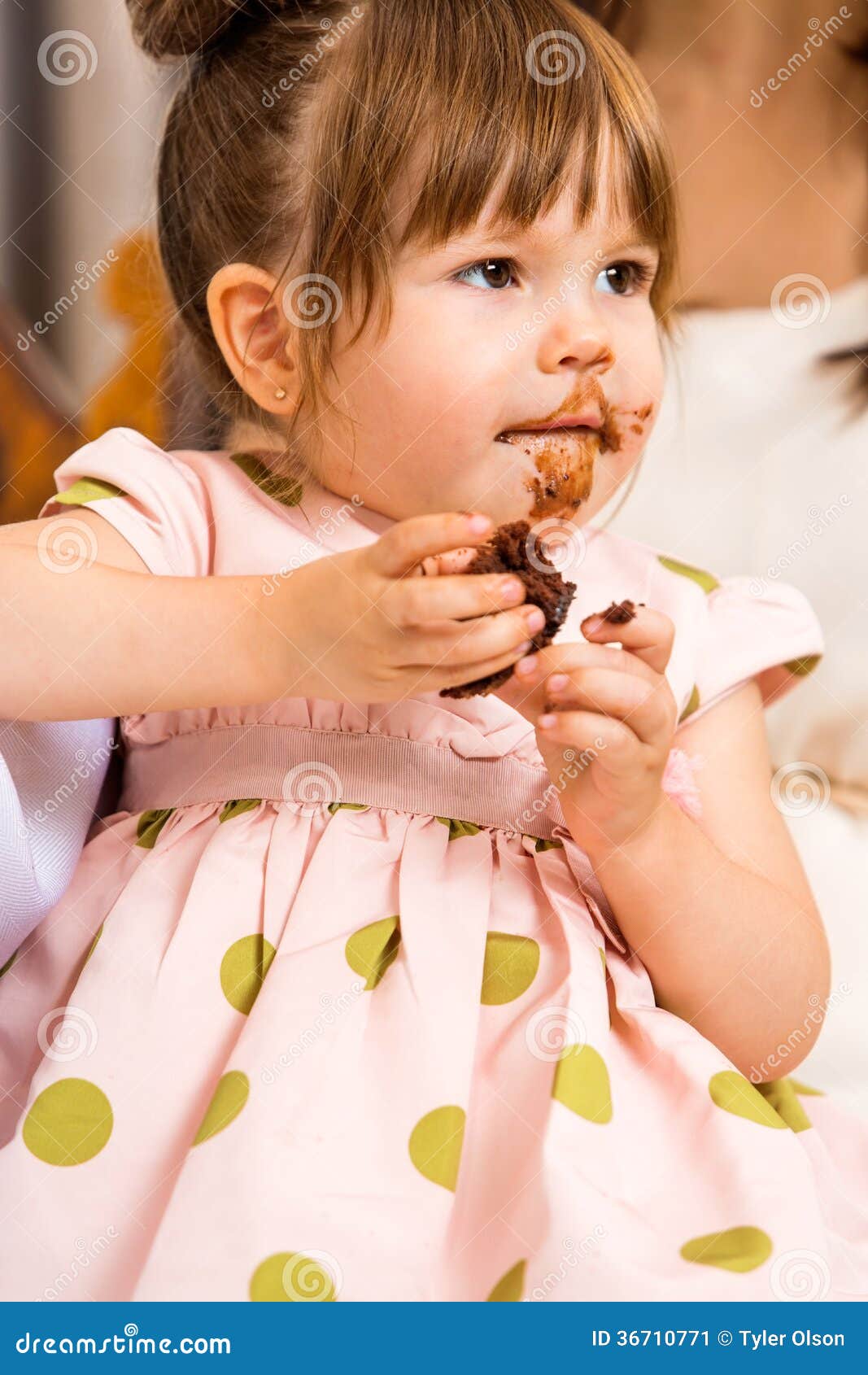 Birthday Girl Eating Cake With Icing On Her Face Stock Image - Image
