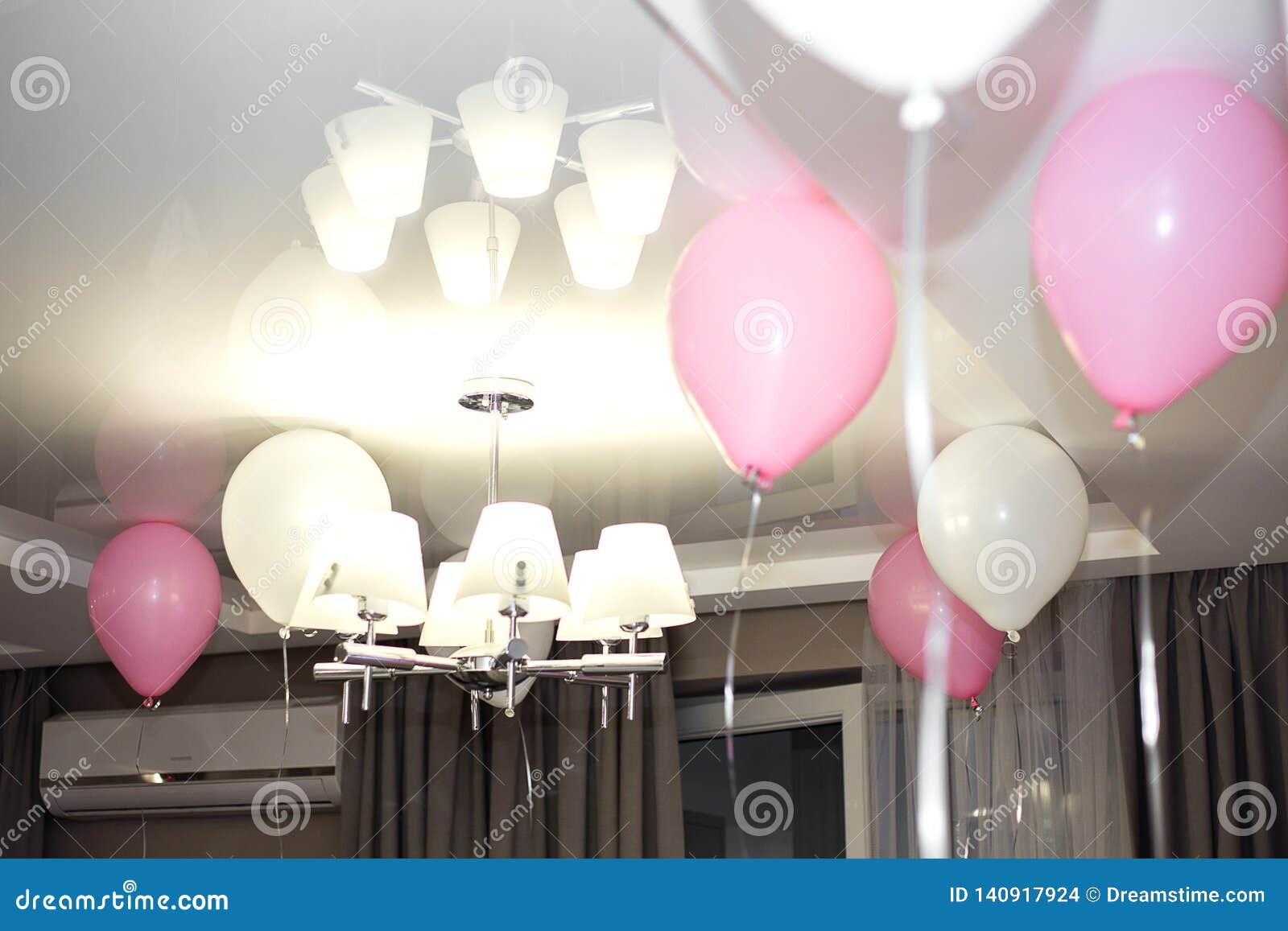 Birthday Pink Balloons Under The Ceiling At Home Stock Photo