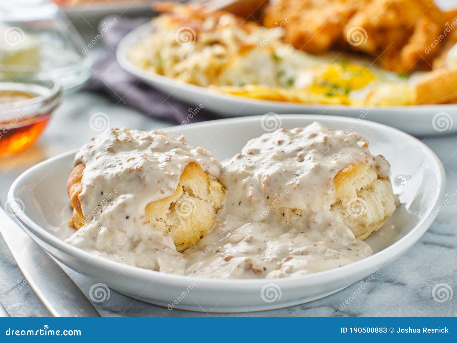 biscuits and gravy with sausage on plate